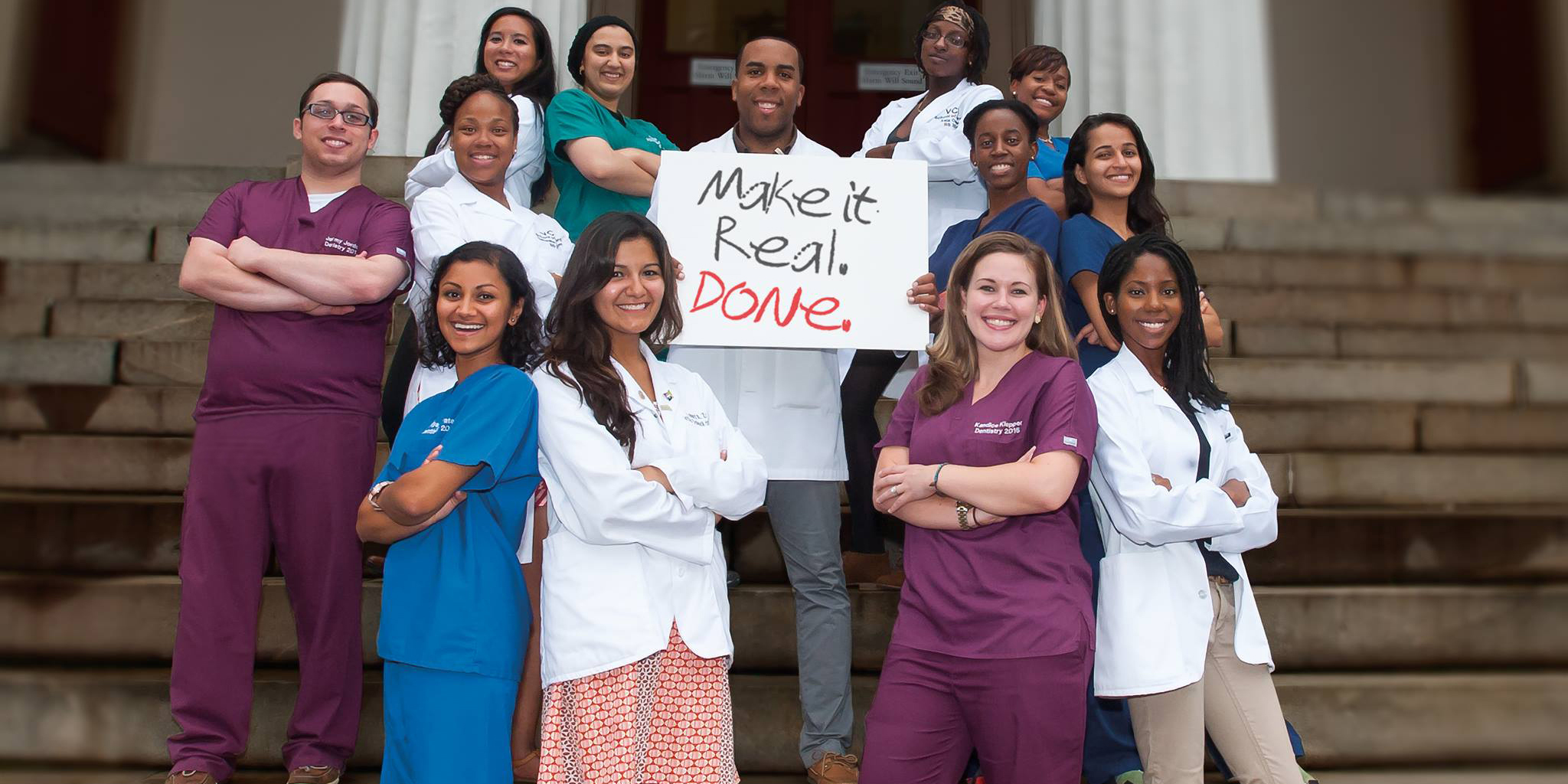 Health professional students holding a sign that reads, 